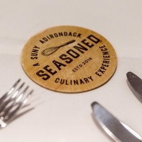 Image of coaster and silverware at Seasoned restaurant
