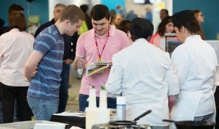 Prospective students visit an Open House event