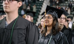 Graduates march into the 2024 commencement ceremony at CIA