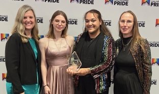 From left, SUNY Adirondack President Anastasia L. Urtz, J.D., student River Watkins, Assistant Director of Student Life Harley Bradley and Dean for Student Affairs Kate O'Sick celebrate SUNY Adirondack being named Southern Adirondack Pride's Community Champion at the annual Gayla on June 12 at The Queensbury Hotel.
