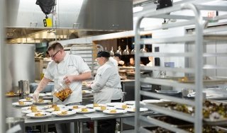 Culinary students work in the Seasoned kitchen