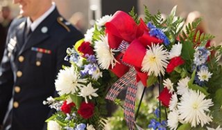 A wreath is displayed at an on-campus Veterans Day ceremony