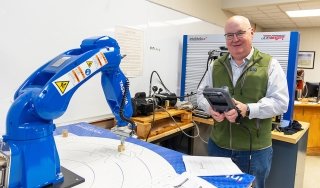 Professor Jeff Clark is seen in an on-campus robotics lab