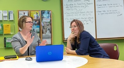 Stephanie Drotos works with an adult student