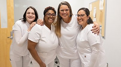 Newly pinned nurses celebrate at the Winter 2024 pinning ceremony.