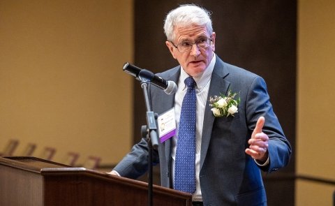 Longtime SUNY Adirondack trustee Robert Judge accepts an award at NYCCT.