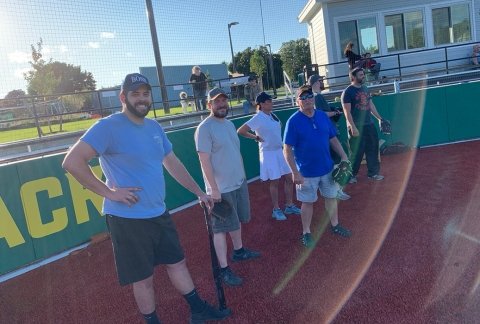 Veterans play in a softball game